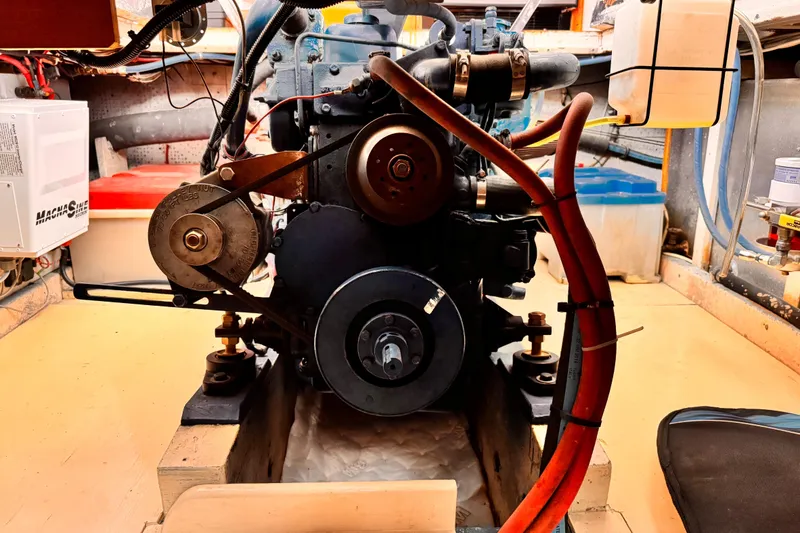 Engine room of a 1978 Roughwater 41 boat, showcasing mechanical components and wiring.