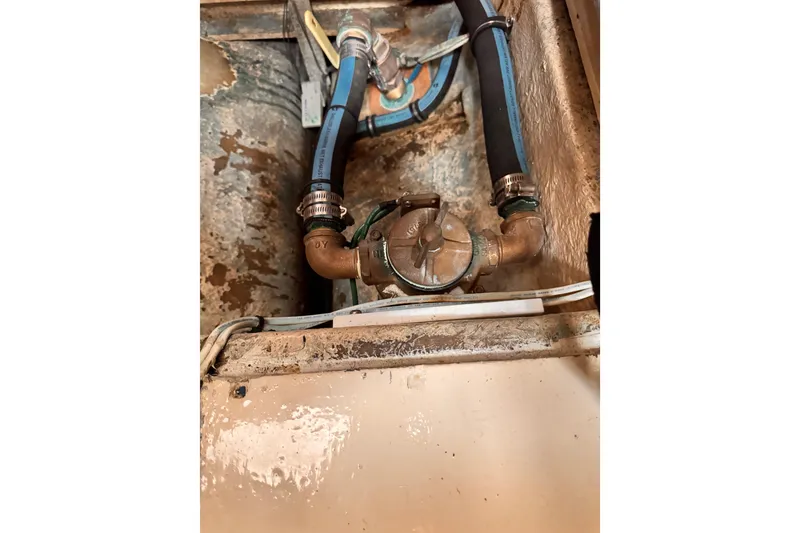 1978 Roughwater 41 engine compartment with hoses and valve system.