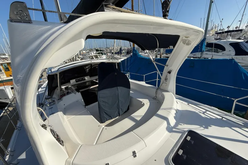 1999 Hunter Passage 420 sailboat cockpit view in marina setting.