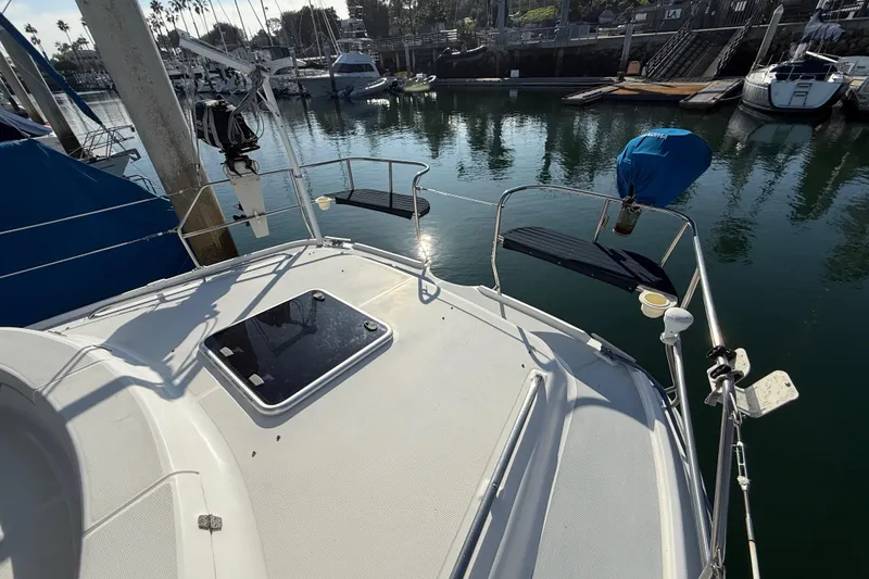 1999 Hunter Passage 420 sailboat deck view in marina setting.