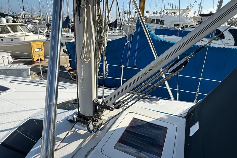 1999 Hunter Passage 420 sailboat deck with rigging and marina background.