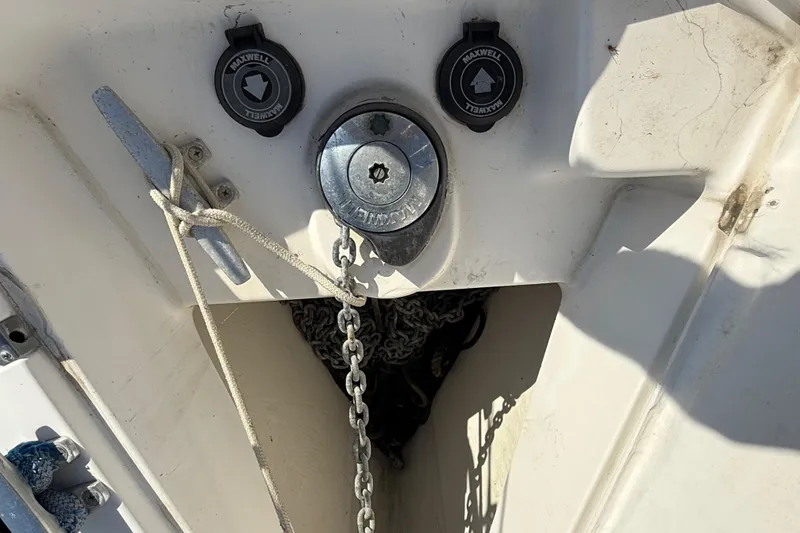 Anchor chain and winch on 1999 Hunter Passage 420 sailboat deck.