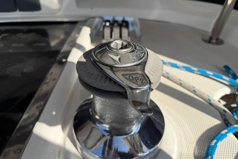 Close-up of a winch on a 1999 Hunter Passage 420 sailboat deck.