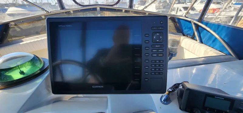 Garmin marine electronics on 1985 Bertram 33 Flybridge Cruiser dashboard.
