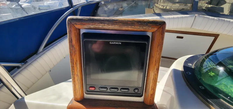Garmin navigation system on 1985 Bertram 33 Flybridge Cruiser boat dashboard.