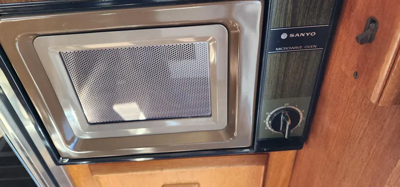 Sanyo microwave oven in 1985 Bertram 33 Flybridge Cruiser kitchen.