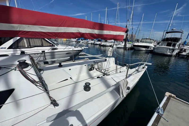 Sailboat Flying Tiger 10M, 2007 model, docked in a marina with clear skies.