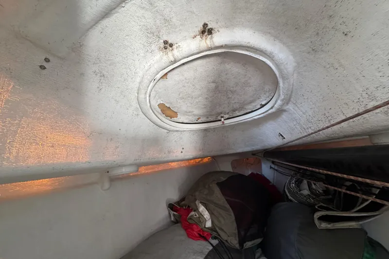 Interior of a 2007 Flying Tiger 10M sailboat with visible hatch and storage area.