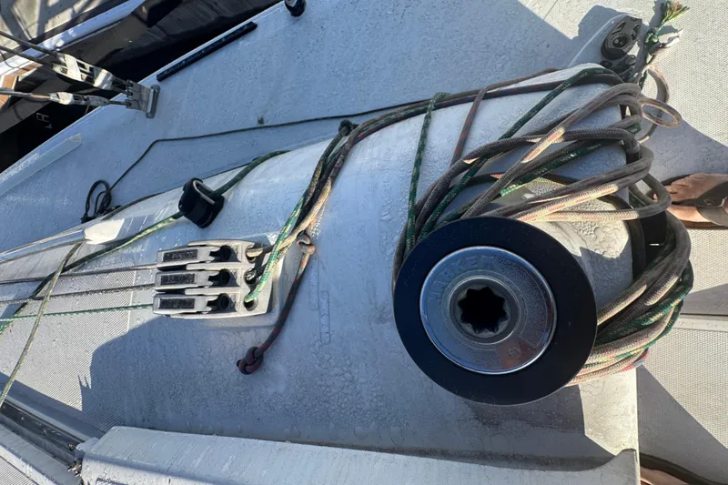 Deck of 2007 Flying Tiger 10M sailboat with ropes and winch.