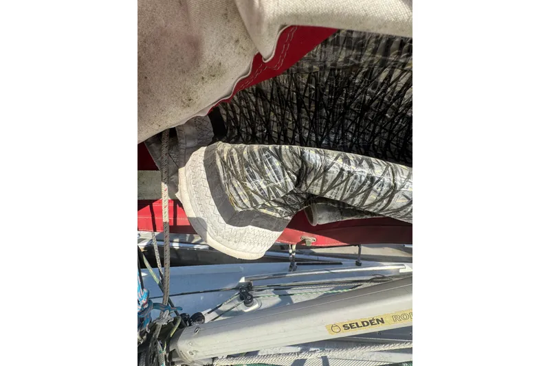 Close-up of a Flying Tiger 10M sailboat's sail and rigging, featuring Selden hardware.