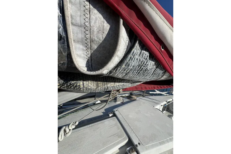 Close-up of a 2007 Flying Tiger 10M sailboat's sail and deck details.