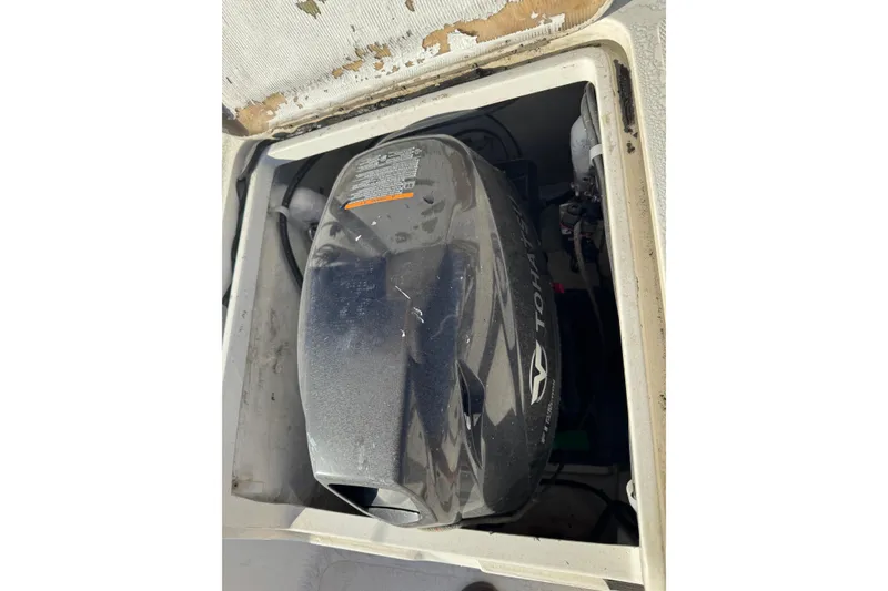 Engine compartment of a 2007 Flying Tiger 10M sailboat, featuring a Tohatsu motor.