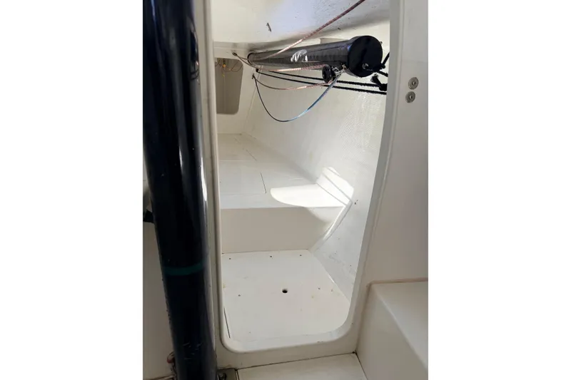 Interior view of a 2007 Flying Tiger 10M sailboat, showcasing cabin space and rigging.