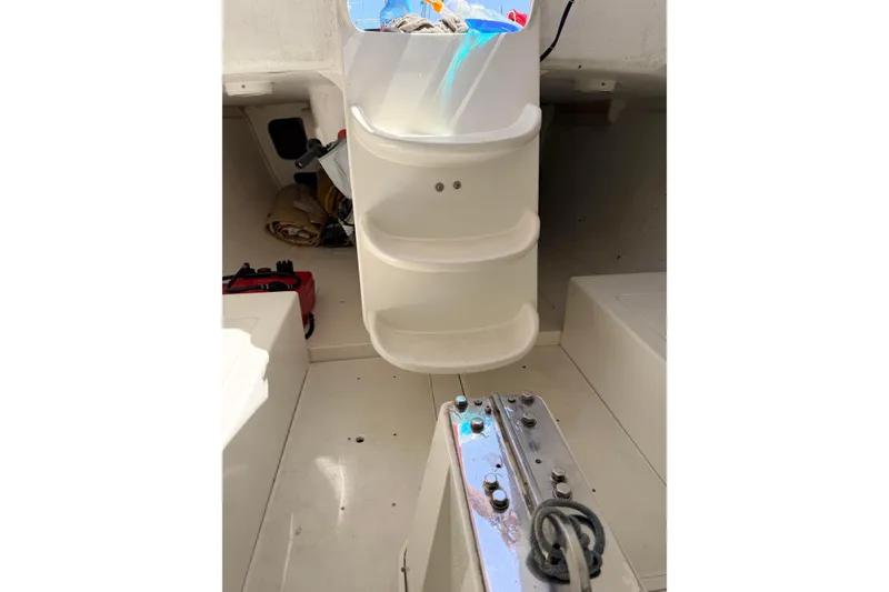 Interior of a 2007 Flying Tiger 10M sailboat, featuring storage compartments and sailing gear.