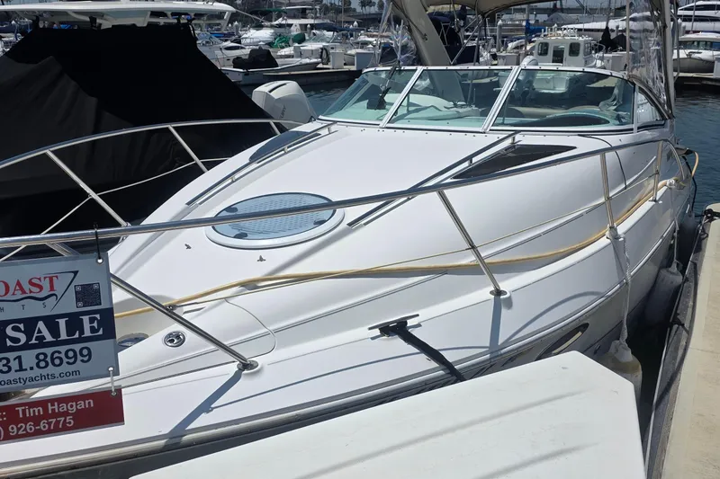 2001 Doral 250se boat for sale at marina, featuring sleek white design.