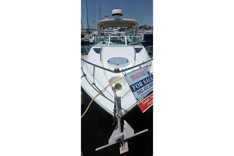 2001 Doral 250se boat for sale at marina, featuring sleek design and spacious deck.