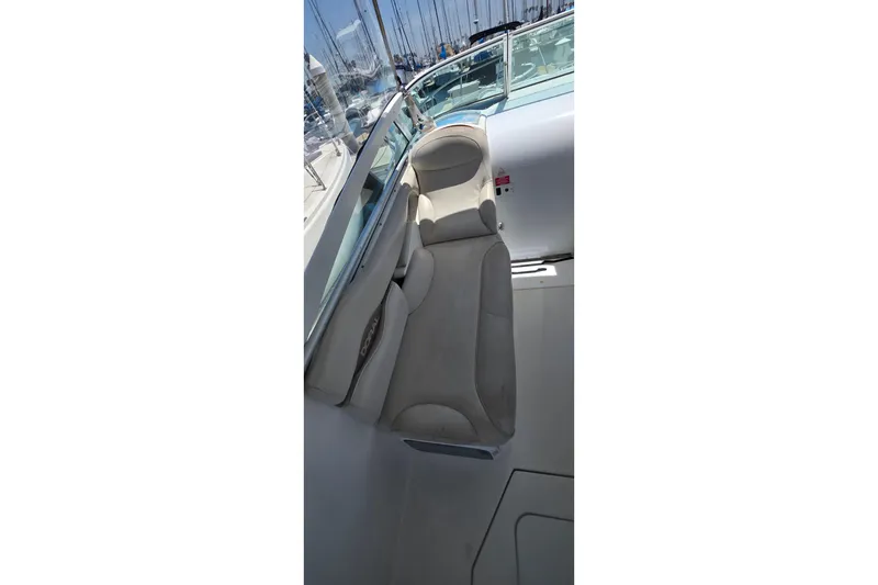 Interior view of a 2001 Doral 250se boat, featuring comfortable seating and sleek design.