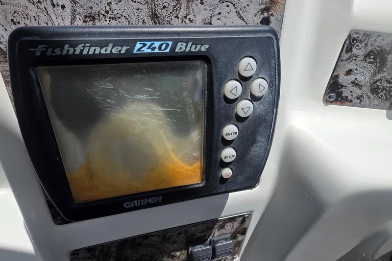 Fishfinder 240 Blue device on a 2001 Doral 250se boat dashboard.