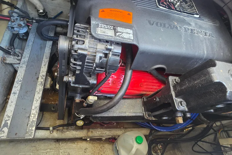 Volvo Penta engine in a 2001 Doral 250se boat, showcasing mechanical components.