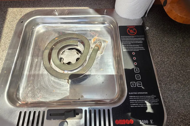Electric stove on a 2001 Doral 250se boat, featuring a single coil burner.