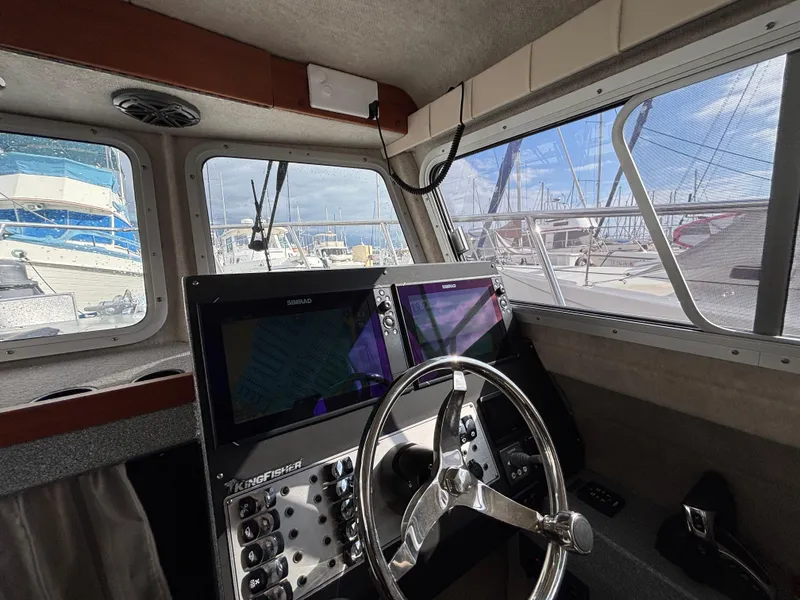 Interior of 2023 KingFisher 3025 Destination boat with modern navigation equipment.