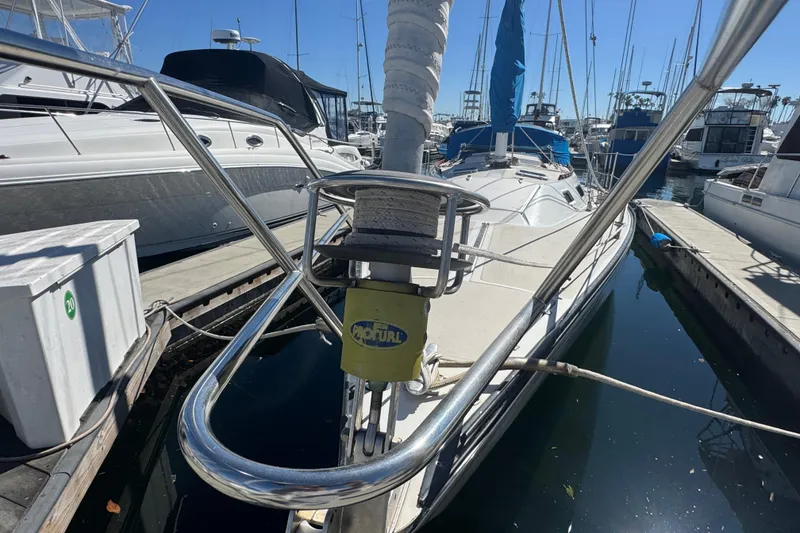1985 Catalina 38 sailboat docked in marina, featuring a ProFurl system.