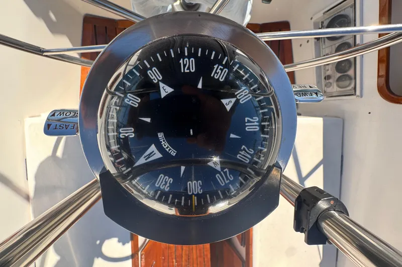 Compass on 1985 Catalina 38 sailboat, showing navigation directions.