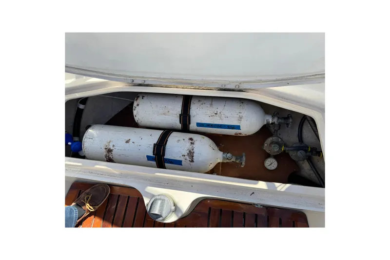 Storage compartment with gas cylinders on a 1985 Catalina 38 sailboat.
