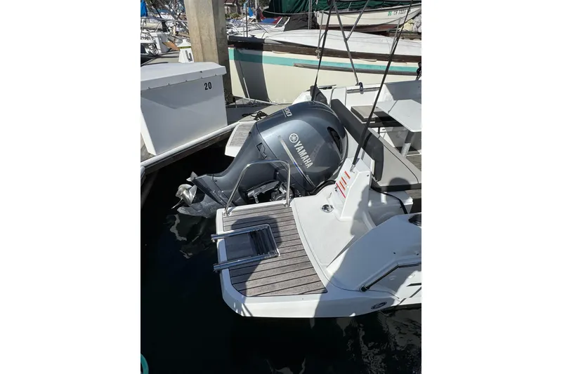 2020 Jeanneau NC 795 boat with Yamaha outboard motor at dock.