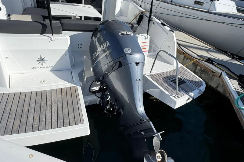 2020 Jeanneau NC 795 boat with Yamaha 200 outboard motor at dock.