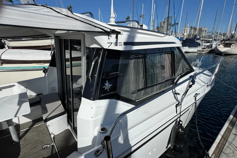 2020 Jeanneau NC 795 boat docked in marina, featuring sleek design and modern amenities.
