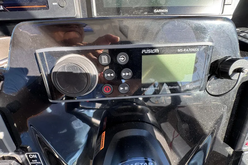 Control panel of a 2020 Jeanneau NC 795 boat featuring a Fusion MS-RA70NSX stereo system.