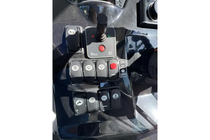 Control panel of a 2020 Jeanneau NC 795 boat with various switches and buttons.