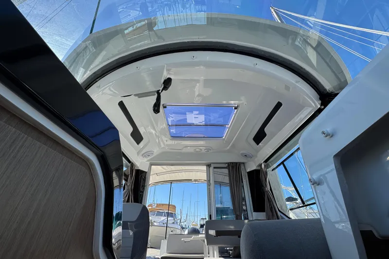 Interior view of 2020 Jeanneau NC 795 boat with skylight and seating area.