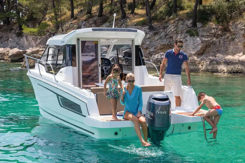 Manufacturer Provided Image: Family enjoying Jeanneau NC 795 boat, 2020 model, in clear turquoise water.
