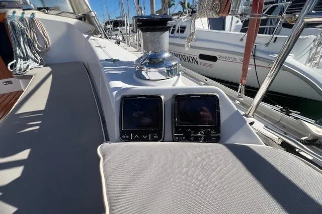 Cockpit of 2016 Catalina 385 sailboat with navigation instruments and winch.