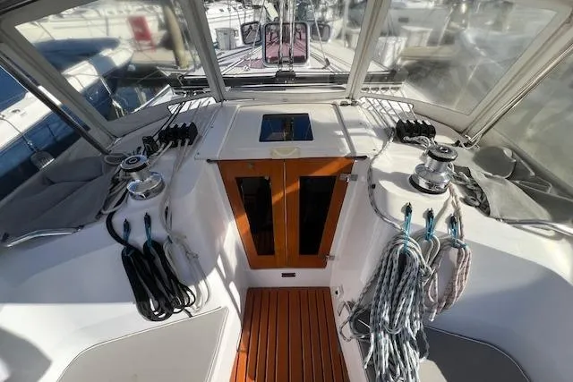 Cockpit of 2016 Catalina 385 sailboat with winches and ropes, showcasing sleek design.