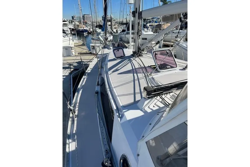 2016 Catalina 385 sailboat docked at marina, showcasing deck and rigging.