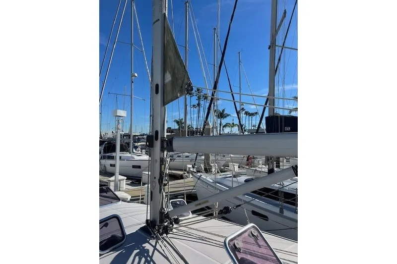 2016 Catalina 385 sailboat mast and rigging at marina under clear blue sky.