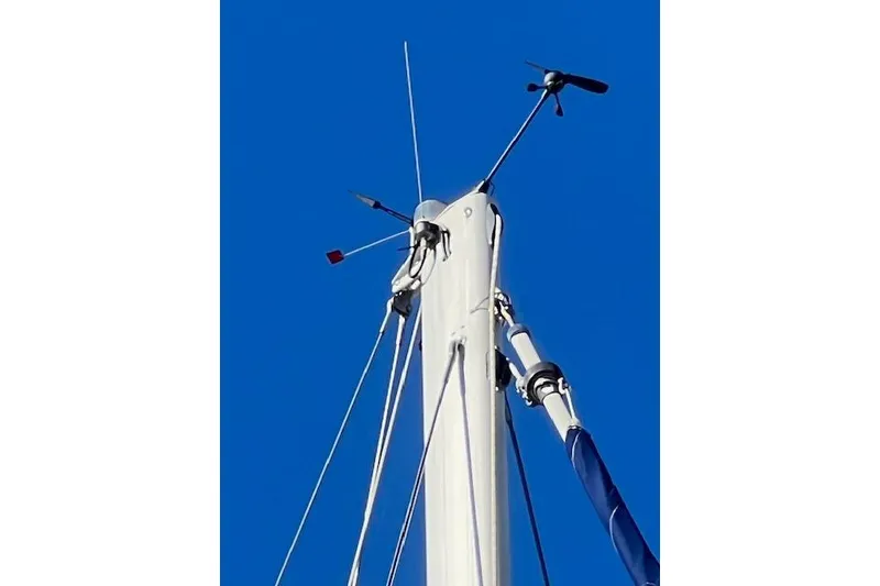 Mast of 2016 Catalina 385 sailboat against clear blue sky.
