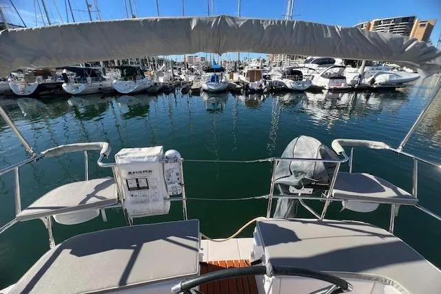 Catalina 385 sailboat, 2016 model, docked in a marina with other boats.