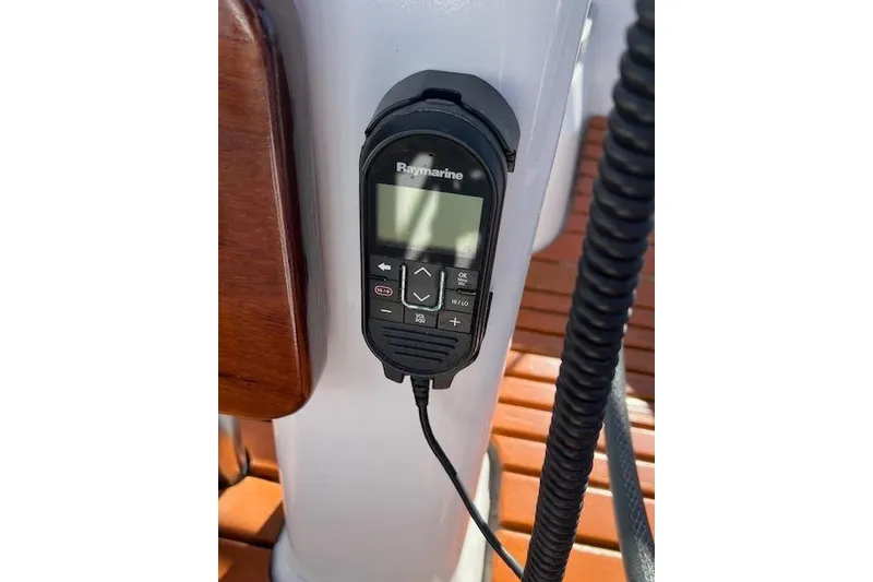 Raymarine marine radio on Catalina 385 sailboat, 2016 model, mounted on white surface.