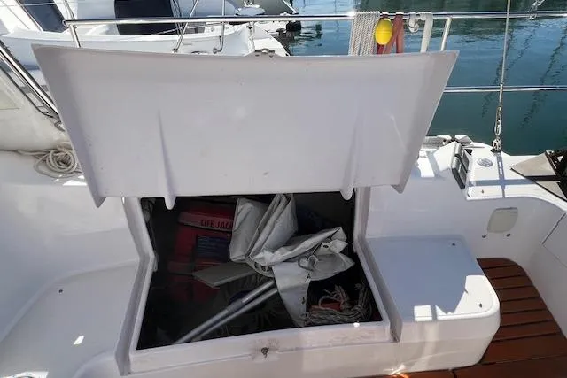 Open storage compartment on 2016 Catalina 385 sailboat, containing ropes and equipment.