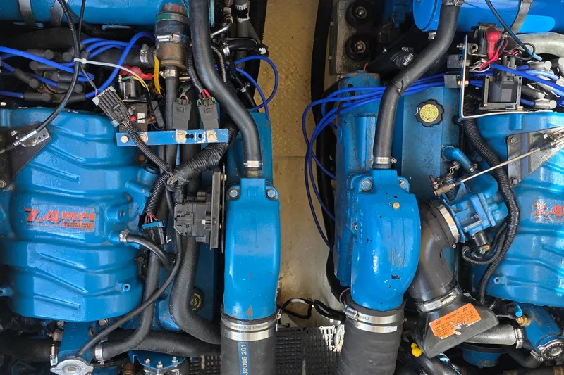 Twin blue marine engines in a 2001 Cruisers Yachts 340 Express boat.