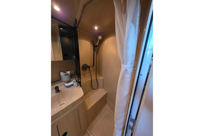 Bathroom interior of 2001 Cruisers Yachts 340 Express with shower and sink.