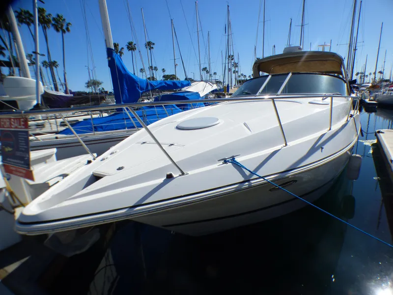 2001 Cruisers Yachts 340 Express docked on a sunny day.