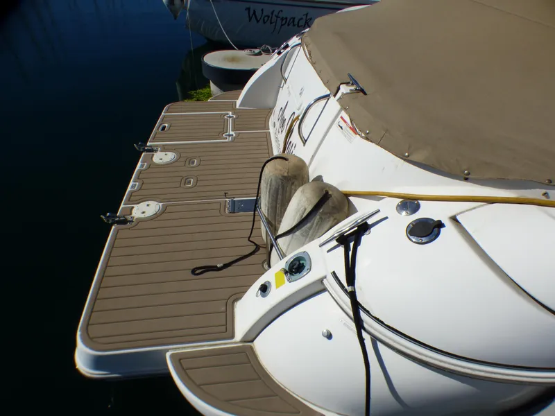 Rear view of a 2001 Cruisers Yachts 340 Express with cover.