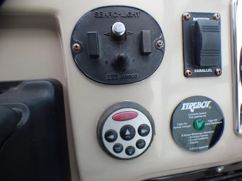 Control panel of 2001 Cruisers Yachts 340 Express with searchlight controls.