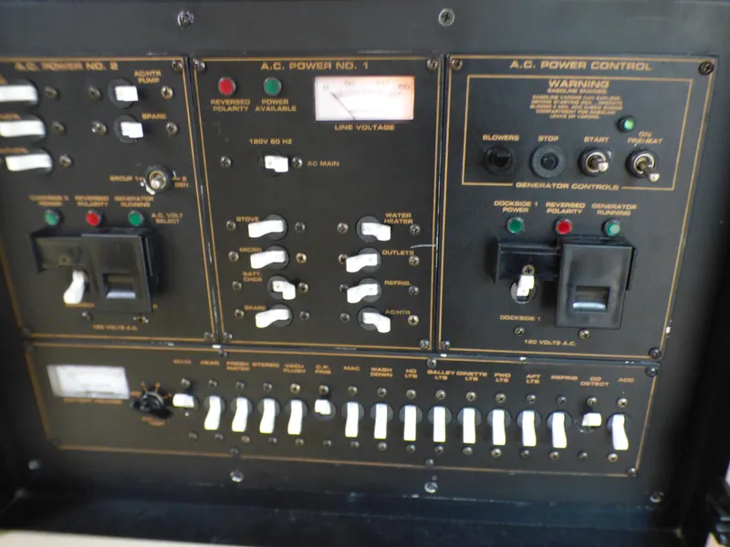 Control panel of 2001 Cruisers Yachts 340 Express with switches and indicators.