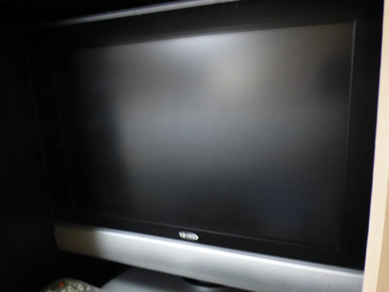 Flat-screen TV in a 2001 Cruisers Yachts 340 Express.